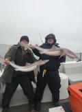 2MenDisplayingFish
